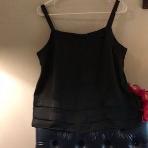 Go out for the evening in this dressy”feels like silk” black top. Size L. NWOT